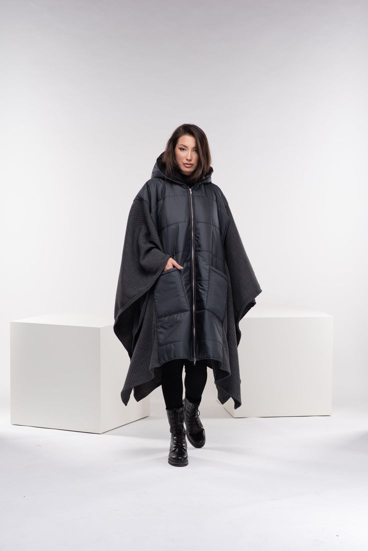 "Stay warm while staying fashionable with this unique puffer jacket poncho with oversized pockets and zipper closure, and a large cozy hood. This maxi quilted coat has a street vibe and is unisex for all body types. You can wear it in different ways, go all the way as a poncho, or halfway through. Made from two fabrics - puffer quilted fabric and wool knitted fabric, and while the textiles are different, there is a relationship in the shapes. A good jacket or coat can really make an outfit. It's the finishing touch before walking out the door. ◼️FIT This puffer jacket is a one-size design. It is roomy and oversized and it fits all our sizes from XS to 4XL. ◼The model in the picture is wearing the color Dark Gray. ◼️FABRIC ◾polyester quilted fabric with viscose lining, knitted acrylic wool Oversized Hooded Puffer Jacket With Detachable Hood, Oversized Hooded Cape For Cold Weather, Oversized Winter Parka For Outdoor, Winter Outdoor Cape, Oversized Hooded Windproof Outerwear, Oversized Windproof Hooded Outerwear, Oversized Hooded Outerwear For Outdoor, Oversized Parka With Adjustable Hood For Cold Weather, Oversized Parka With Double-lined Hood For Cold Weather