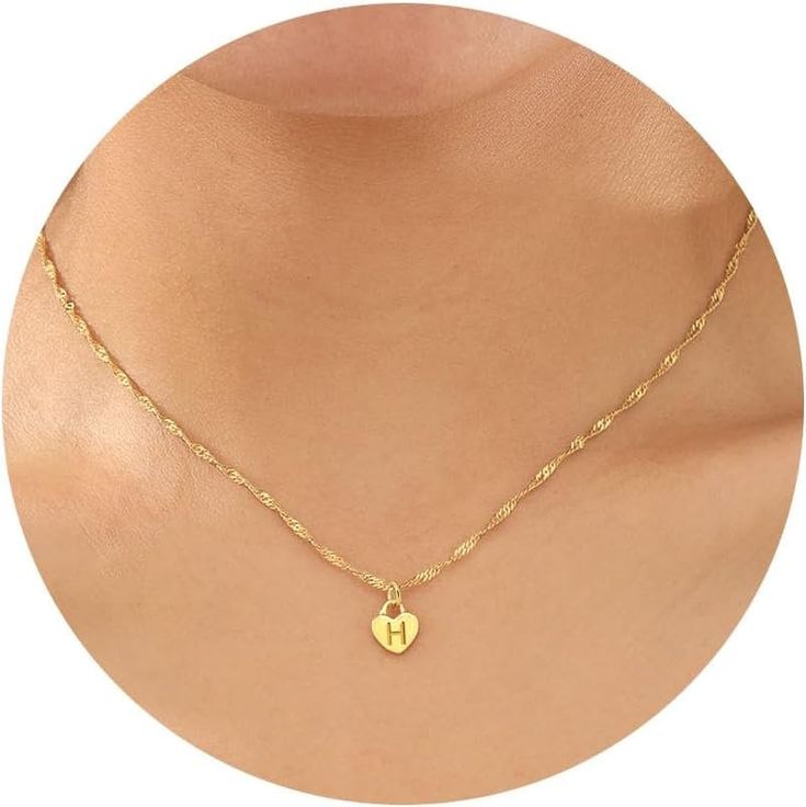 Discover the charm of our Tiny Heart Initial Pendant Necklace, a piece that combines personal significance with timeless elegance. Crafted to complement any attire, this necklace makes for a perfect gift or a lovely treat for yourself." ✦ MATERIALS & DESIGN ✦ Pendant Perfection: The heart initial pendant, measuring 10mm x 12mm, is beautifully crafted with 18K gold plated over stainless steel, ensuring durability and a radiant finish. Versatile Chain: Accompanied by a 2-inch extender, our chains Dainty Initial Necklace With Charms For Gift, Dainty Charm Necklace With Initial Pendant As A Gift, Dainty Initial Pendant Charm Necklace For Gift, Dainty Initial Pendant Charm Necklace As Gift, Dainty Initial Pendant Charm Necklace For Mother's Day, Dainty Open Heart Locket Necklace With Heart Charm, Dainty Mother's Day Charm Necklace With Initial Pendant, Dainty Mother's Day Initial Pendant Charm Necklace, Heart Pendant Locket Necklace As Gift For Her