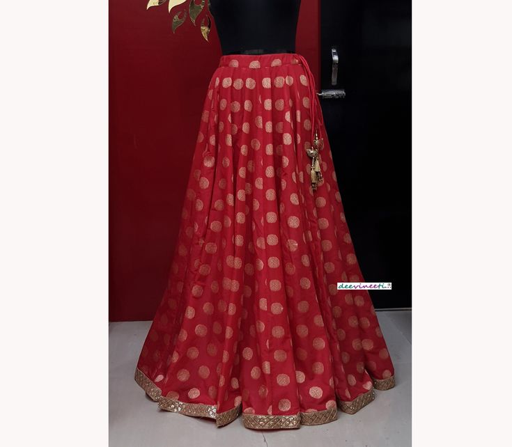 Made to Order/Made to Measurement/Custom Made Indian Lehenga Skirt (PLEASE NOTE THIS IS SKIRT ONLY) - Fabric: Brocade Silk - Color : Red - Fully Flared Kalidaar (Paneled) Skirt - Lined - Gold Sequins Border - Drawstring with beautiful  gold latkan - No can can This is Made To Order and we require following measurements in inches. 1. Waist of Skirt 2. Length of Skirt PLEASE NOTE: BUYERS ARE RESPONSIBLE FOR ANY CUSTOMS AND IMPORT TAXES THAT MAY APPLY. Fabric Care : Dry Clean Only Disclaimer: The a Traditional Floor-length Skirt Set For Party, Elegant Party Skirt With Zari Work, Traditional Fitted Tiered Skirt, Fitted Tiered Skirt For Festivals, Elegant Long Skirt Set For Festive Occasions, Traditional Red Skirt For Party, Full Length Red Party Skirt, Fitted Skirt For Festivals, Fitted Flared Skirt For Festivals