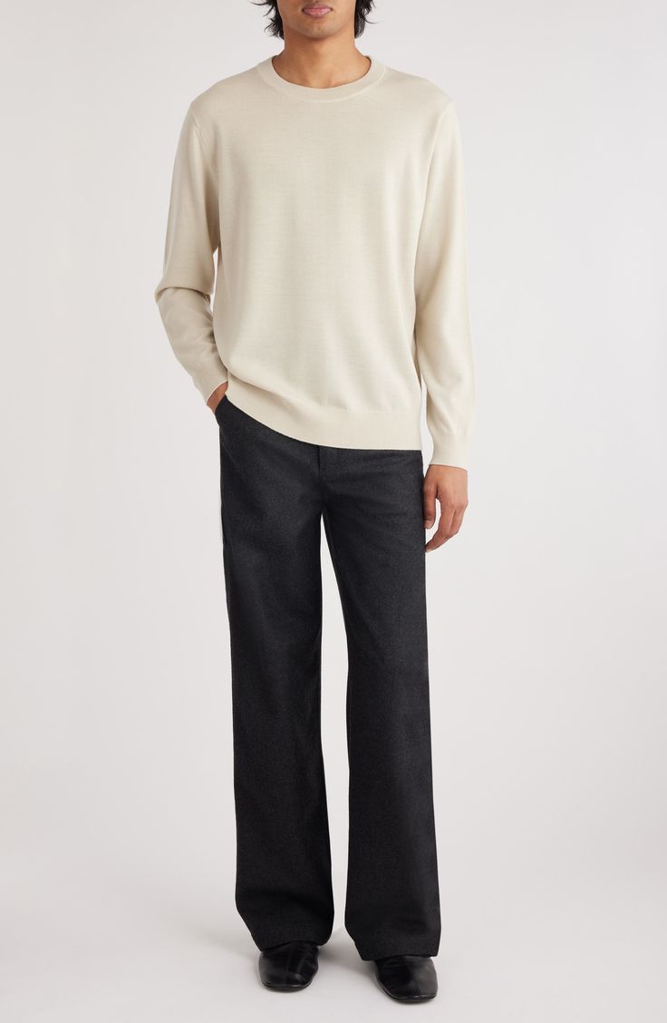 Casual and versatile, this sweater knit from soft, breathable wool features a relaxed fit that's easy to layer and always comfortable on its own. Crewneck Long sleeves Ribbed cuffs and hem 100% merino wool Dry clean or hand wash, dry flat Imported Designer Clothing Cream Cashmere V-neck Sweater For Winter, Casual Cashmere Sweater With Relaxed Fit, Casual Relaxed Fit Cashmere Sweater, Relaxed Fit Turtleneck Sweater For Work, Turtleneck Sweater With Relaxed Fit For Work, Casual Beige Merino Wool Tops, Casual Cashmere Textured Knit Sweater, Classic Textured Knit Turtleneck Sweater, Cream Textured Knit Cashmere Sweater