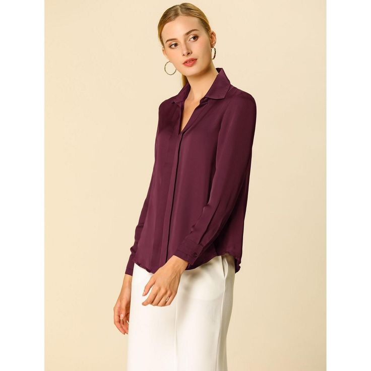 The smooth, soft, and minimalist design updates this collared no-buttons shirt for understated charm. This seriously chic long-sleeve shirt is the perfect way to elegantly elevate any outfit. This simple shirt is an elegant take on a wardrobe classic, featuring a stylish v-neckline. The charm of women is shown perfectly at this moment. In a red smooth fabric, this can be styled up or down whatever the occasion. Just tuck the front into black or white pants for an office day. Office Wear Tops With Button Closure, Collared Workwear Blouse, Collared Solid Color Blouse For Work, Solid Collared Office Shirt, Solid Button-up Tops For Workwear, Solid Collared Tops For Office, Solid Collared Blouse For Business Casual, Solid Color Collared Blouse For Business Casual, Solid Lapel Collar Tops For Office