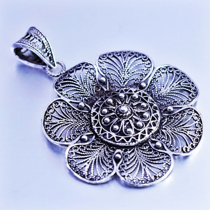 antique sterling 925 silver filigree flower pendant charm, stamped 925 Antique Silver Filigree Jewelry, Elegant Antique Silver Jewelry With Charms, Silver Jewelry With Intricate Flower Design, Vintage Silver Filigree Jewelry, Antique Silver Jewelry With Filigree, Traditional Jewelry With Flower Charm And Shape, Sterling Silver Jewelry With Intricate Flower Design, Antique Silver Pendant Jewelry With Charms, Traditional Jewelry With Flower Charm