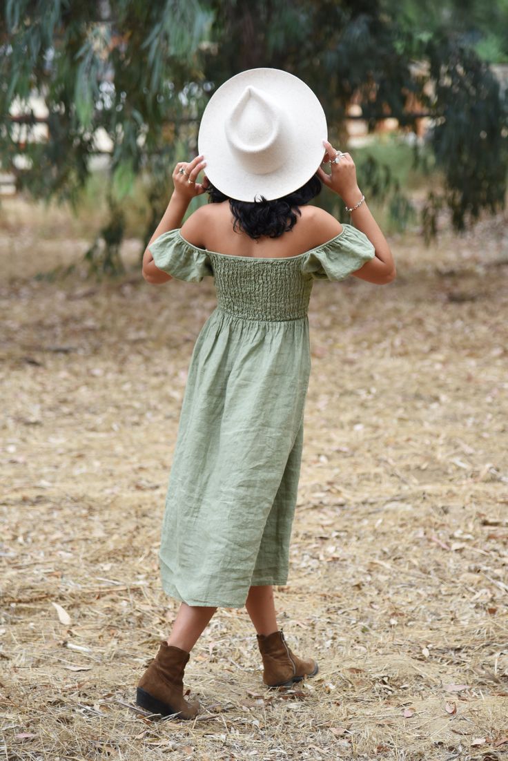 Style // Our newest shade of the perfect green. Sage is a light and fresh color and perfect for any occasion. Effortlessly romantic and oh so pretty. Designed to transition throughout the year. Pair with sandals for summer or boots for fall and winter, the Menorca Dress is a timeless piece to take you from season to season. Made from super-soft linen, with puffed sleeves that can be worn the way you love best! Fit Note: Available in two sizes, this dress features an elastic fitted bodice, ideal Light Green Summer Vacation Dress, Light Green Beach Sundress, Light Green Sundress For Beach, Light Green Sundress For The Beach, Bohemian Linen Midi Dress For Vacation, Light Green Summer Beach Dress, Light Green Beach Dress For Summer, Light Green Knee-length Summer Dress, Summer Linen Dress For Garden Party