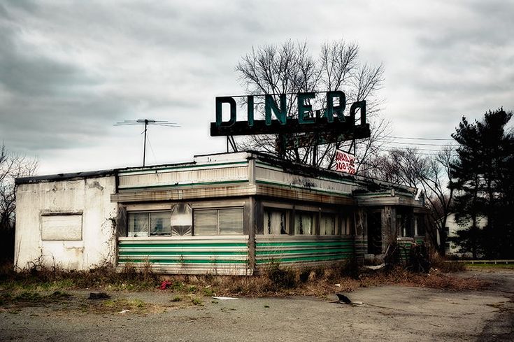 an old run down diner sitting in the middle of nowhere