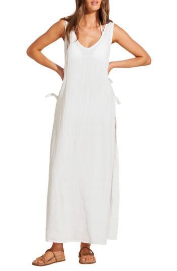 You'll feel like a vintage starlet when you're walking along the beach in this linen-and-cotton dress with an open side that dramatically catches the breeze. 54" length (size X-small) Side ties Deep V-neck Sleeveless 80% linen, 20% cotton Hand wash, dry flat Imported Linen Beach Dress For Spring Day Out, Spring Linen Beach Dress For Day Out, Chic Linen Beach Dress For Vacation, Spring Day Out Linen Beach Dress, Linen Maxi Dress For Beach Cover-up, Cotton Beachwear Maxi Dress For Daywear, White Linen Sundress For Day Out, Linen Dress For Beach Season Day Out, Cotton Maxi Dress For Beach Daywear