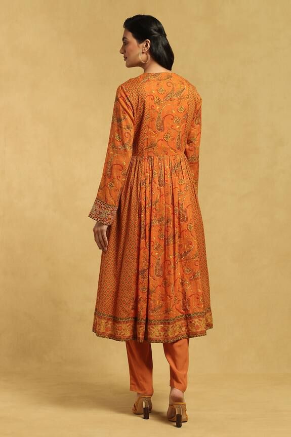 Orange full sleeve anarkali with all over paisley vine and mandala motifs print. Paired with a pant and dupatta.
Components: 3
Pattern: Print
Type Of Work: Paisley
Neckline: Round Neck
Sleeve Type: Round Neck
Fabric: Anarkali: Cotton 100s Voile, Pant: Rayon Slub, Dupatta: Cotton Voile
Color: Orange
Other Details: 
Anarkali:
Floral embroidered placket
Motif embroidered cuffs
Pant:
Side pockets
Closure: Drawstring
Dupatta:
Motif print border
Occasion: Puja - Aza Fashions Full Sleeve Anarkali, Orange Anarkali, Mandala Motifs, Embroidered Cuffs, Ritu Kumar, Cuffed Pants, Fashion App, Cotton Voile, Set For Women