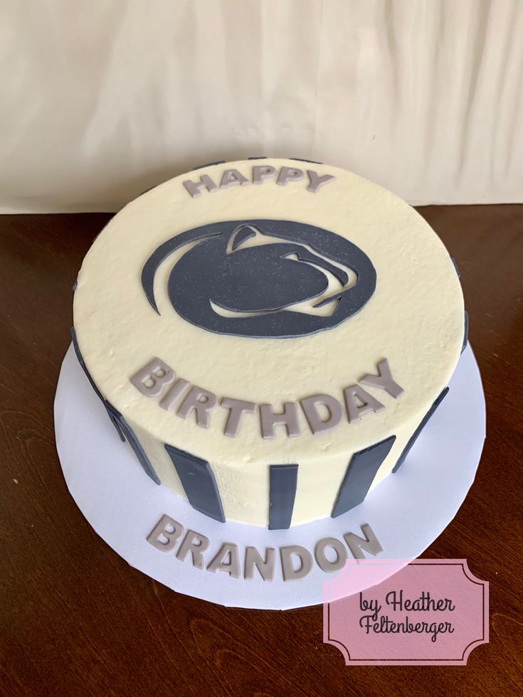 a birthday cake with the words happy birthday brandon on it and an image of a penn football helmet