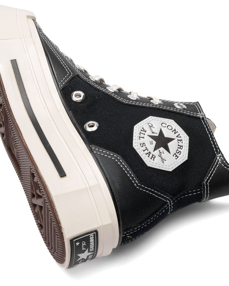 Signature style, reimagined. The Chuck 70 De Luxed Squared takes a geometric approach to unmistakable design details. Angular overlays, eyelets, and patches give your look just enough edge, while heritage styling stays true to your favorite shoes. High-top shoe with a canvas upper and faux leather overlays OrthoLite cushioning helps provide optimal comfort Angular overlays, eyelets, and patches reimagine Chuck Taylor DNA Reimagined rubber midsole details for an unexpected look Squared toe adds b Hip Hop Cargo Pants, Cool Converse, Converse Logo, High Top Shoe, Dr Shoes, Shoes Outfit Fashion, Converse Chuck 70, Chuck 70, Bold Style