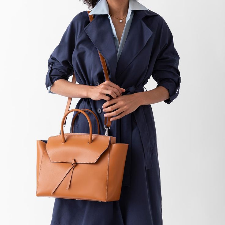 Are you ready to be that stylish woman who walks into the office with one leather tote that does it all? The Loren Tote is the ultimate everyday work bag because it’s made with our signature lightweight Italian leather that holds its shape over time, doesn’t scratch and is easy to clean. Plus, it’s spacious, stylish and so lightweight, that it won’t break your back. Timeless Structured Bag With Smooth Grain, Versatile Briefcase Tote For Work, Versatile Briefcase Tote For Professional Use, Fall Satchel With Top Handle And Leather Lining, Fall Top Handle Satchel With Leather Lining, Timeless Structured Everyday Bag, Versatile Briefcase With Top Carry Handle For Work, Versatile Cognac Bag With Smooth Grain, Timeless Shoulder Bag For Travel In Fall