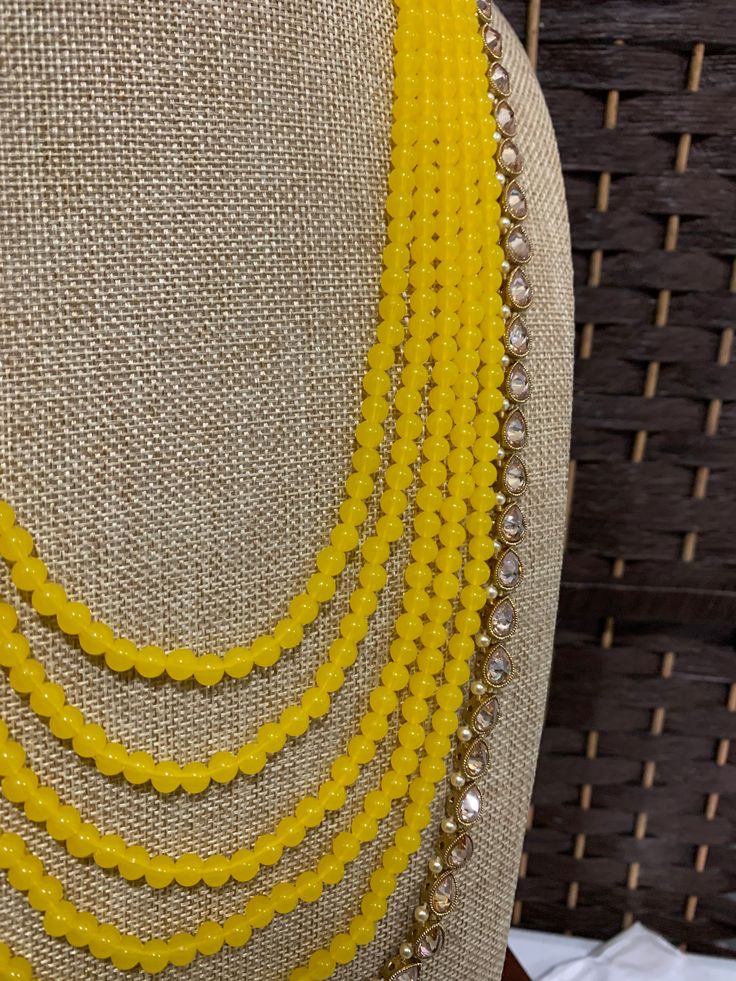 Clear polki long mala, pearl work. 5 layers of bead work and one line of polki . listed as just mala Bride or groom both can wear. Pearl Work, Braided Rugs, Bead Work, Beads, Chain, Yellow