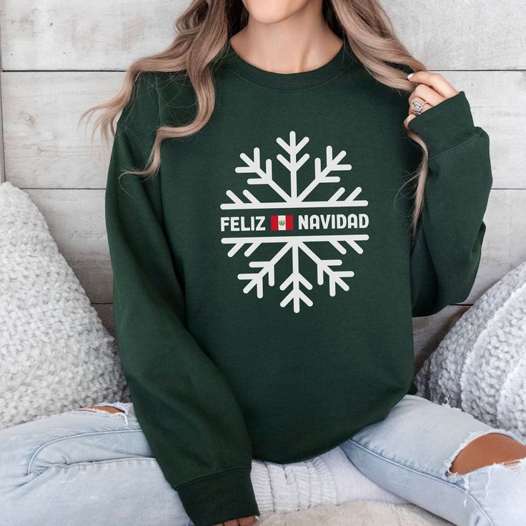 A festive, colorful, and cozy sweatshirt for the Christmas holiday. Lounge around in this comfy Christmas sweatshirt as you open gifts and socialize with family.  A thoughtful gift for either women or men.  The sweatshirt is unisex. Most of the models are all female but the shirt fits both men and women.  The Sport Grey sweatshirt logo will be in the colors of the country's flag.   Please see the mockup pictures for more details. PRODUCT DETAILS *The classic fit along with the crew neckline deliver a comfy wearing experience with a clean-cut style. Meanwhile, the double-needle stitching at the shoulder, armhole, neck, waistband, and cuff seams add top-tier durability.  *Made with a medium-heavy fabric blend of 50% cotton and 50% polyester (8.0 oz/yd² (271.25 g/m this sweatshirt feels cozy Green Winter Sweatshirt For Gift, Green Winter Sweatshirt Gift, Green Winter Sweatshirt For Gifts, Winter Crew Neck Sweater As Gift, Green Winter Sweatshirt As Gift, Crew Neck Sweatshirt For Winter Gift, Winter Graphic Print Sweater For Gift, Winter Graphic Print Sweater Gift, Graphic Print Sweater For Winter Gift