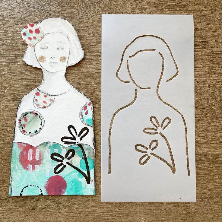 a paper doll next to a cutout of a woman's face on a piece of paper