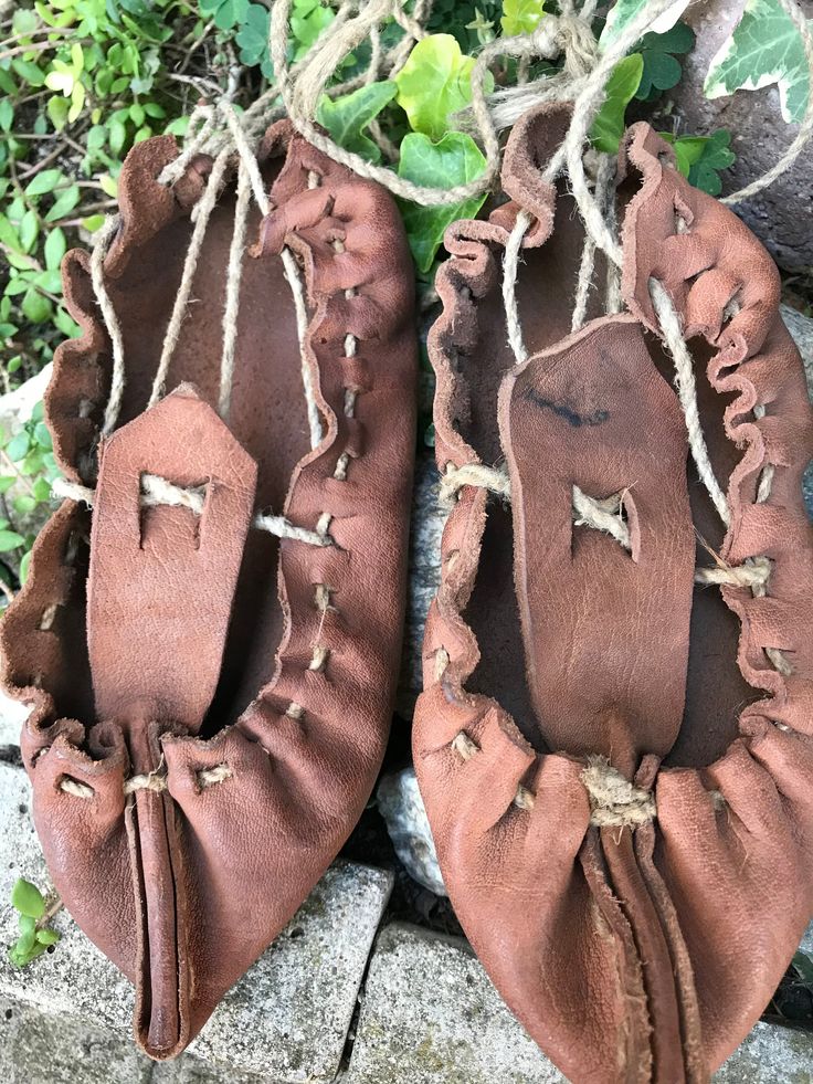 "Vintage folk leather sandals -antique handmade Bulgarian folk shoe -primitive handmade shoes -traditional shoes -primitive rural shoes This is primitive shoes from the beginning of the last century and handmade from calfskin. The leather is very thick and solid. There are abrasions and fading in the skin, but are in very good condition. These traditional Bulgarian shoes are called \"tsarvuli\". They are wonderful for decoration of a farmhouse. MEASUREMENTS: Length: 18.5 cm (7.28 in) I send each Handmade Traditional Closed Toe Clogs, Traditional Handmade Closed Toe Clogs, Traditional Handmade Clogs With Round Toe, Festival Moccasins With Soft Sole And Round Toe, Soft Sole Round Toe Moccasins For Festival, Traditional Brown Moccasins For Festival, Traditional Closed Toe Clogs With Leather Sole, Leather Barefoot Sandals With Round Toe, Traditional Natural Color Round Toe Sandals