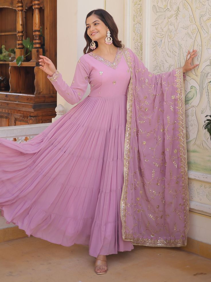 Elevate your style with our stunning pretty light purple sequins georgette function wear gown with dupatta. This gorgeous gown is crafted from light purple georgette material and adorned with intricate embroidered and sequin work, making it the perfect choice for festivals, events, or any special function.
The gown comes fully stitched in sizes ranging from XS to XXL, ensuring a perfect fit for every body type. With a 12-meter flair and a gown length of 56 inches, this gown exudes elegance and g Lavender Anarkali Floor-length Set, Wedding Lavender Georgette Dupatta, Lavender Wedding Dress With Sheer Dupatta, Lavender Georgette Lehenga For Party, Semi-stitched Lavender Anarkali Set With Dupatta, Lavender Georgette Sharara With Dupatta, Festive Lavender Georgette Sharara, Lavender Floor-length Dupatta For Party, Semi-stitched Purple Gown With Sheer Dupatta