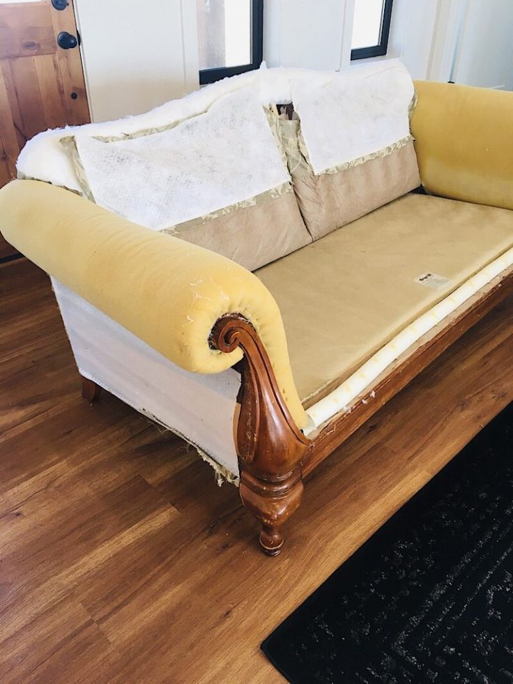 a couch that is sitting on top of a wooden floor