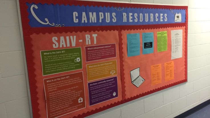 a bulletin board on the wall in a hallway with information about campus resources written on it