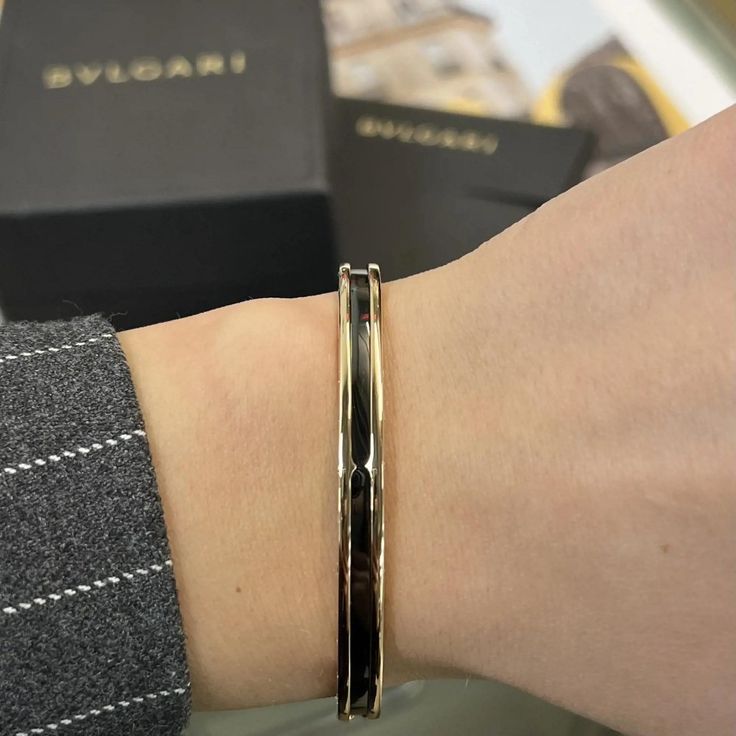 This Stunning B.Zero1 Open Cuff Bracelet Comes From The House Of Bvlgari. Well Crafted In 18k Rose Gold And Ceramic. This Bracelet Features Black Ceramic In The Center With Rose Gold Frame. Bvlgari Logo Engraving On The Edges. Size: Medium. Wrist Measurement: 7 Inches. Width: 6 Mm. Total Weight: 20.32 Grams. Made In Italy. Condition: New Without Tags. Comes With An Original Box And Paper. Id: 02297 Luxury 14k Rose Gold Cuff Bracelet, Luxury Yellow Gold Bangle For Evening, Luxury Rose Gold Cuff Bracelet For Formal Occasions, Luxury Rose Gold Cuff Bracelet For Formal Events, Formal Rose Gold Round Cuff Bracelet, Luxury Rose Gold Bangle Cuff Bracelet, Luxury 14k Gold Cuff Bracelet With Polished Finish, Luxury Yellow Gold Cuff Bracelet With Shiny Finish, Luxury 14k White Gold Cuff Bracelet