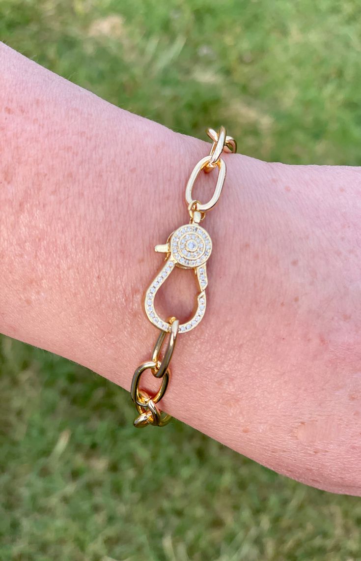 This item is available for local pick up from Magnolia, TX or select a shipping option and have it shipped directly to you. Spend over $99 and shipping is on me! This chain bracelet features a rhinestone diamond clasp that adds a touch of sparkle and elegance. It is versatile and can be worn alone as a statement piece or layered with other bracelets for a stylish look. The bracelet is of excellent quality, ensuring long-lasting durability and a timeless appeal. The bracelet measures 8.25 inches Elegant Metal Chain Bracelet With Bling, Elegant Chain Link Bracelet With Clasp, Elegant Metal Chain Bracelet With Clasp, Elegant Gold Crystal Bracelet With Lobster Clasp, Elegant Adjustable Chain Bracelet With Bling, Elegant Bling Chain Bracelet Adjustable, Elegant Adjustable Bling Chain Bracelet, Diamond Bracelet With Cubic Zirconia Chain, Link Chain Bracelet With Diamond Accents