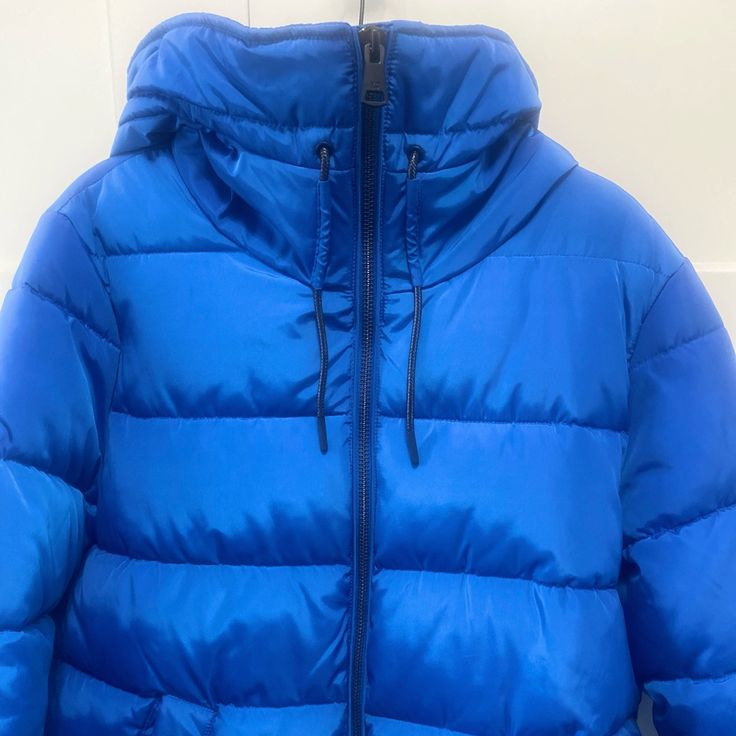 Brand New Puffer Jacket In A Gorgeous Blue! Blue Puffer Jacket With Pockets For Outdoor, Blue Nylon Puffer Outerwear, Blue Puffer Outerwear For Outdoor, Blue Nylon Puffer Jacket For Fall, Blue Nylon Puffer Jacket For Cold Weather, Blue Nylon Puffer Jacket For Spring, Blue Nylon Spring Puffer Jacket, Blue Nylon Winter Outerwear, Blue Hooded Puffer Jacket With Pockets