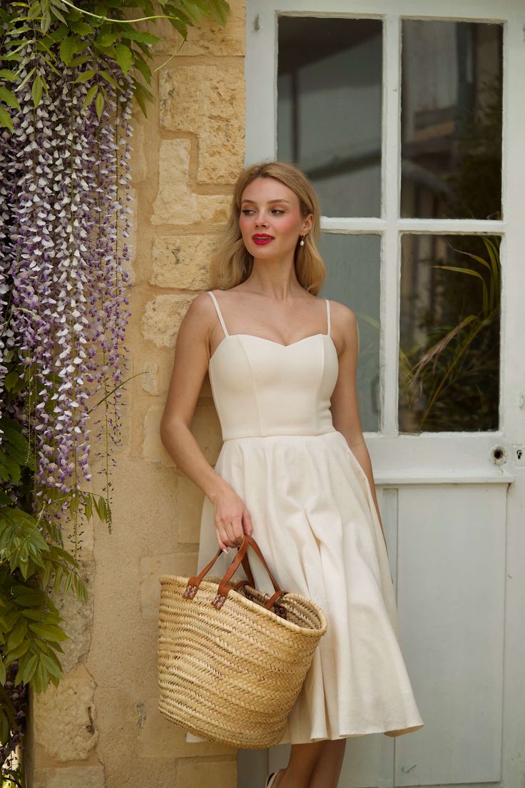 Crafted from sustainable linen, this Bardot linen dress features a sweetheart neckline framing a fitted bodice and waist. A detachable vintage-inspired petticoat crafted from cotton is included with the dress, allowing you to elevate the silhouette with dramatic volume for special occasions or go without for everyday wear. The model measures 173 cm and is wearing a size S. *All items labeled with a “P” indicate petite sizing. Bridal Entourage, Sweetheart Neckline Dress, Bardot Dress, Slow Fashion Brands, Wedding Boutique, Made Clothing, Cream Dress, Dream Wedding Dresses, Linen Dress