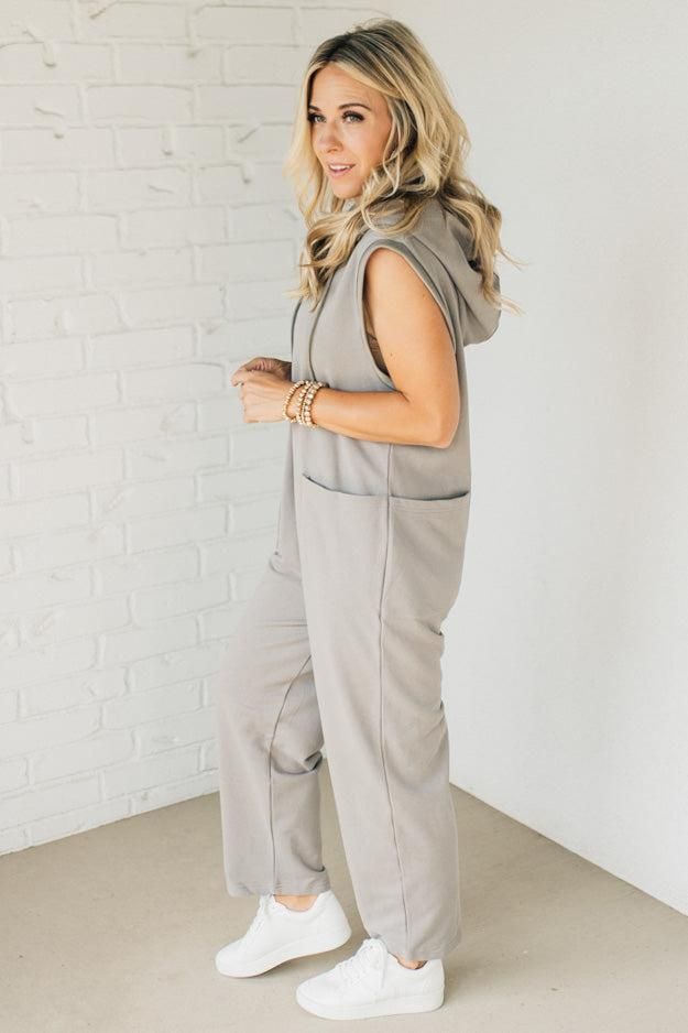 With its oversized hood and doubled front and back pockets, this long jumpsuit not only keeps you warm but also stylish. Introducing the ultimate cozy one-piece: the Flynn French Terry Jumpsuit. The button front henley adds a touch of sophistication to this versatile wardrobe must-have. 100% Cotton Deep Side Pockets, front + back Slouch Fit Oversized Hood Button Front Oversized Armhole SIZING: Model is 5'4" wears a size 5 and is modeling the small. Small 2-4 Medium 6-8 Large 10-12 X-Large 14-16 Gray Cotton Jumpsuits And Rompers For Loungewear, Winter Solid Jumpsuits And Rompers For Loungewear, Winter Relaxed Fit Jumpsuits And Rompers With Pockets, Casual Fall Loungewear Jumpsuits And Rompers, Casual Fall Jumpsuits And Rompers For Loungewear, Gray Jumpsuits And Rompers For Fall Loungewear, Casual Gray Jumpsuits And Rompers For Lounging, Casual Winter Loungewear Jumpsuits And Rompers, Oversized Solid Color Loungewear Jumpsuit