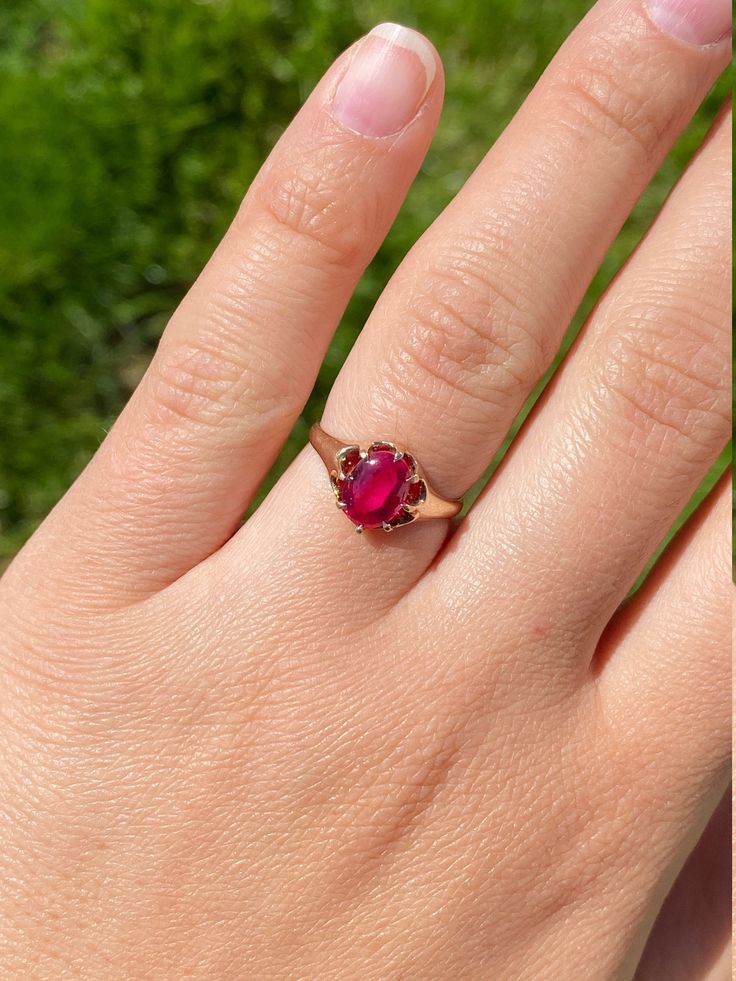 The Pendleton Ladies Yellow Gold Cocktail Ring set with Laboratory Grown Ruby. Crafted in yellow gold, this vintage ladies ring centers on a vibrant cabochon laboratory grown ruby. The inside of the shank is stamped F.B. although we have not identified the maker yet. Currently a finger size 5.75, this ring can be easily resized for an additional charge. Each piece has been hand selected and meticulously identified and graded by a Graduate Gemologist who has been awarded a degree by the Gemologic Classic Red Ruby Ring, Oval Cabochon, Classic Red Ruby Ring With Oval Cabochon, Classic Red Oval Cabochon Signet Ring, Vintage Red Signet Ring With Oval Cabochon, Classic Yellow Gold Cabochon Ruby Ring, Classic Yellow Gold Ruby Cabochon Ring, Vintage Red Oval Cabochon Signet Ring, Yellow Gold Cabochon Ruby Ring, Heirloom Ruby Signet Ring With Hallmark