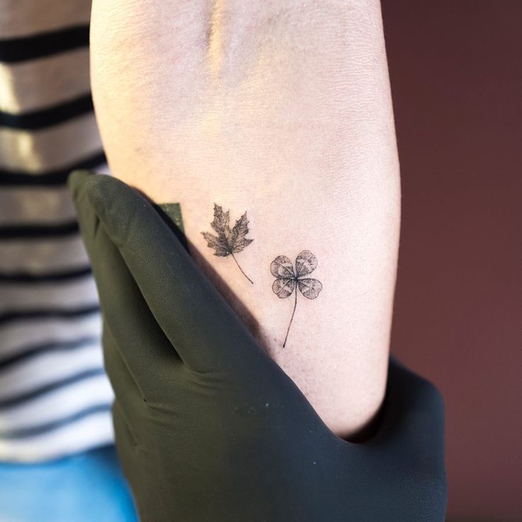 a woman's foot with three leaf clover tattoo on her left side calfal