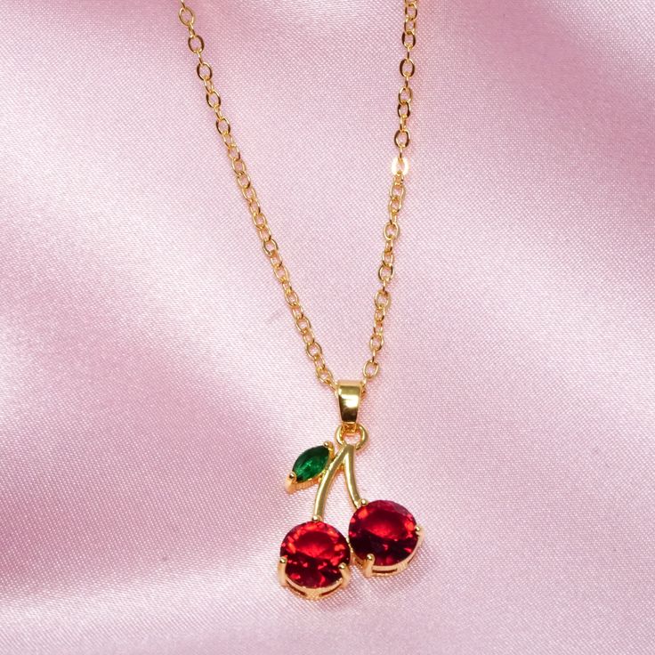 Cherry necklace  Good quality  Gold plated 14k  Brass Cherries are always a fresh, fruity, fun accessory to any style. These charming cherry necklaces make great gifts and are also lovely items to treat yourself with. They're a sweet summertime accessory that has great depth of color and shine. Sweet Jewelry With Fruit Design For Gift, Cherry Colored Jewelry For Valentine's Day Party, Cherry Color Jewelry For Valentine's Day Party, Cherry Jewelry For Valentine's Day Party, Cherry-colored Jewelry For Valentine's Day Party, Sweet Red Jewelry For Valentine's Day, Cute Cherry-colored Jewelry For Gifts, Cute Cherry-colored Jewelry Gift, Red Cherry Print Jewelry For Gifts