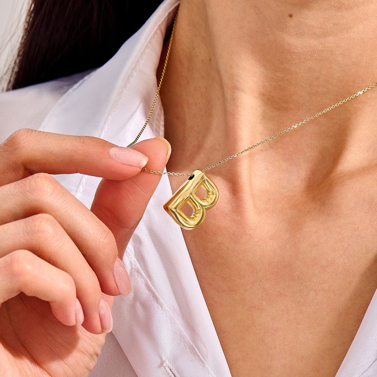 Make a statement with our Bubble Letter Necklace. This chic piece features a bold, bubble-shaped letter that reflects your unique identity. Whether worn alone or layered with other pieces, it brings a trendy yet elegant vibe, making it an ideal gift for yourself or a loved one. - Made in 14k Solid Gold - Pendant Length: 20 mm / 0.78 inches- Thickness: 6 mm / 0.24 inches -This product comes with iconic Norm Jewels gift box Polished Initial Necklace As Gift, Polished Finish Initial Necklace Gift, Chic Personalized Initial Pendant Necklace, Formal Initial Pendant Necklace, Modern Gold Name Necklace, Modern Necklaces For Mother's Day Anniversary, Modern Necklace For Anniversary On Mother's Day, Modern Initial Pendant Necklace For Anniversary, Modern Yellow Gold Initial Pendant Necklace