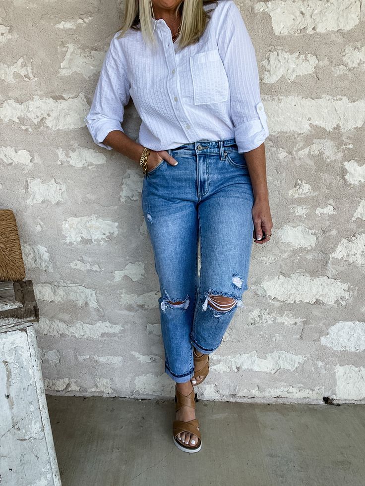 Our new 'Sunfaded Midrise Boyfriend' jeans are designed with a relaxed leg and cuff for the effortless modern look. They feature a mid rise fit, distressing on the thigh, knees, and back pockets and frayed bottom hem for a trendy look - and the light wash is perfect for any spring and summer outfit! Kancan brand denim True to size Rise 9.5", Inseam 27" in size 5/26 99% Cotton, 1% Spandex Machine wash cold and tumble dry low Straight Leg Jeans With Frayed Hem For Casual Wear, Ripped Light Wash Cropped Jeans For Fall, Distressed Mid-rise Cropped Jeans For Everyday, Relaxed Fit Mid-rise Jeans For Day Out, Chic Light Wash Distressed Cropped Jeans, Chic Distressed Light Wash Cropped Jeans, Trendy Washed Cropped Jeans For Everyday, Trendy Distressed Cropped Jeans For Everyday, Everyday Distressed Cropped Jeans For Spring