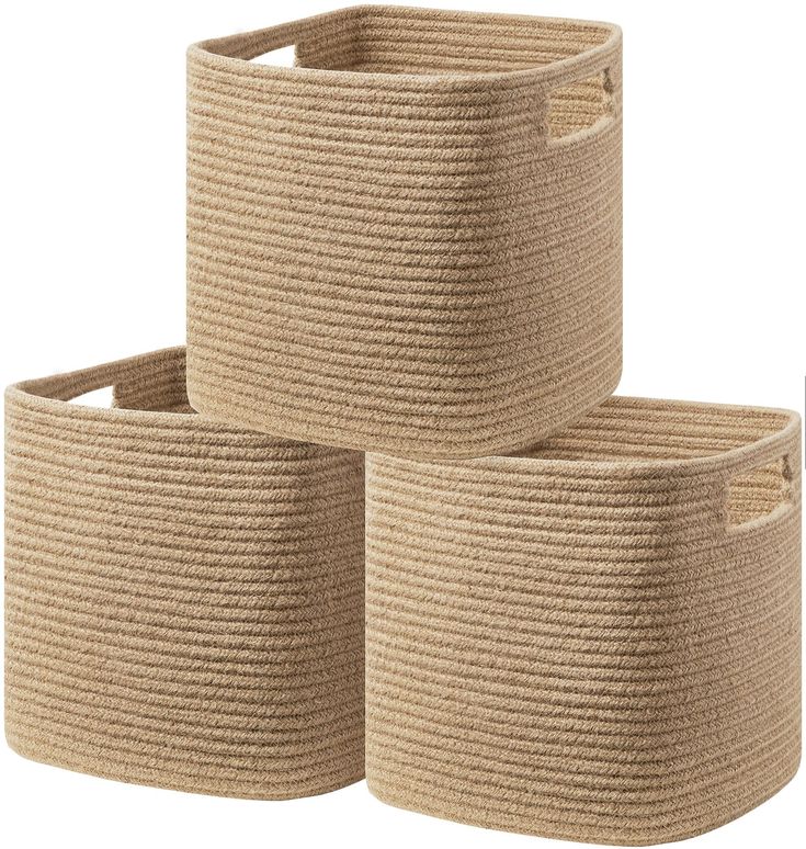 three woven baskets are stacked on top of each other, one is brown and the other is beige