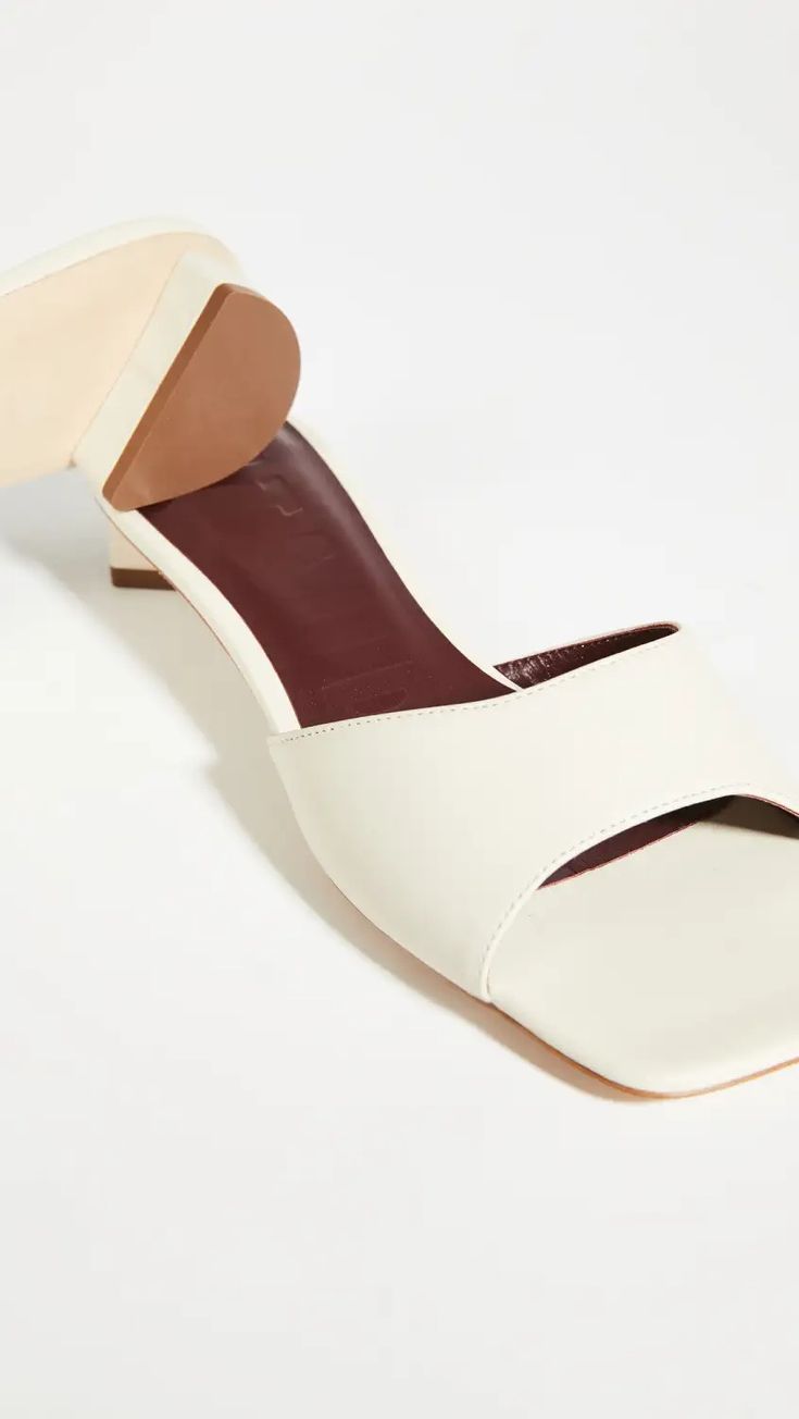 STAUD Simone Mules | Shopbop Formal Block Heels With Wooden Square Toe, Cream Leather Block Heels With Sculpted Heel, Cream Leather High Heel Block Heels, Modern Low Heel With Wrapped Design, Cream Leather Block Heels With Padded Heel, Cream Leather Square-toe Heels, Cream Leather Square Toe Heels, Chic Cream Leather Block Heels, Leather Mules With Wrapped Low Heel