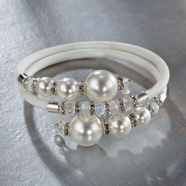 Handmade exclusively for Uno Alla Volta by our artisan Lorena of Murano, this white Murano glass ''pearl'' memory wire bracelet is a unique accessory. The combination of pearlescent glass beads and an expandable band gives this bracelet a unique look. Handcrafted exclusively for Uno Alla Volta, from the heart and hands of the artisan.  Dimensions- will fit most. Adjustable Pearl White Beaded Bracelets With Pearl Drop, Adjustable White Pearl Bracelets, Elegant White Pearl Bracelet With Spacer Beads, White Bangle Stretch Bracelet For Wedding, Adjustable Pearl White Stretch Bracelet With Pearl Charm, White Pearl Stretch Bracelet With Spacer Beads, Adjustable Beaded Pearl White Crystal Bracelet, Adjustable Pearl White Beaded Crystal Bracelet, White Pearl Bracelet With Charm For Party