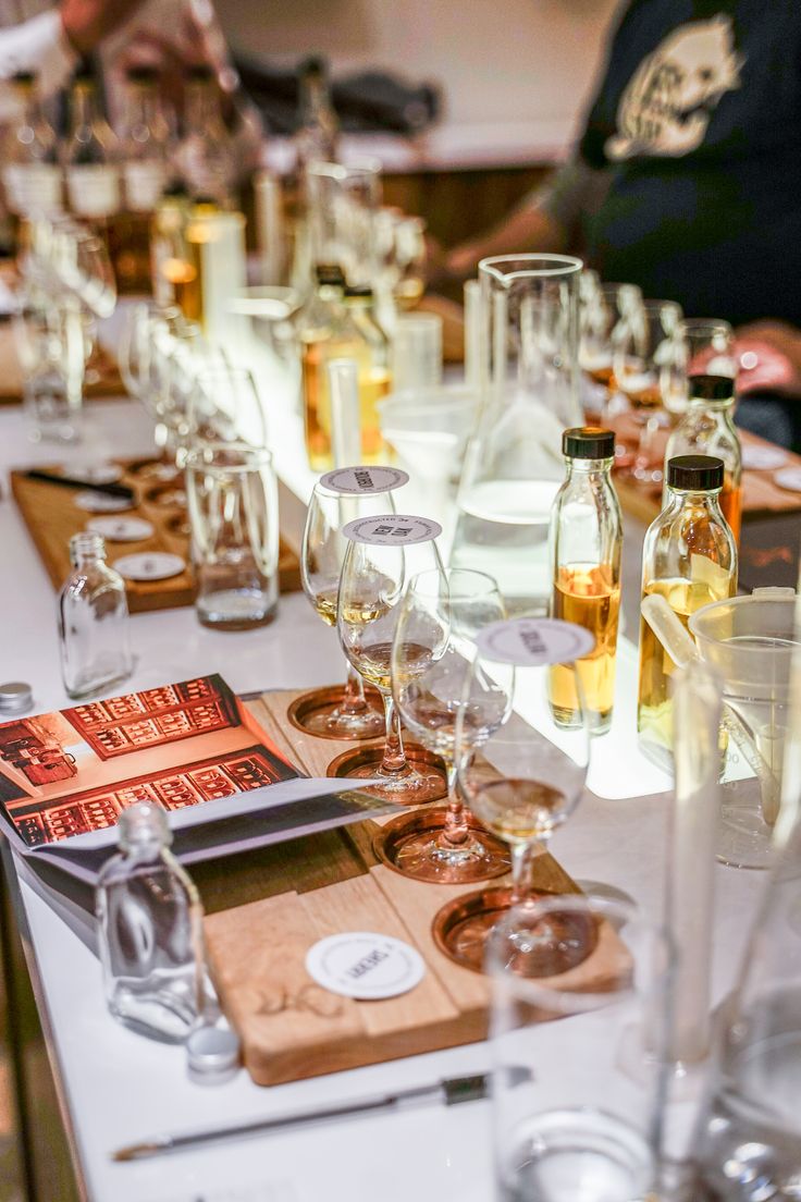 a long table with many glasses and bottles on it