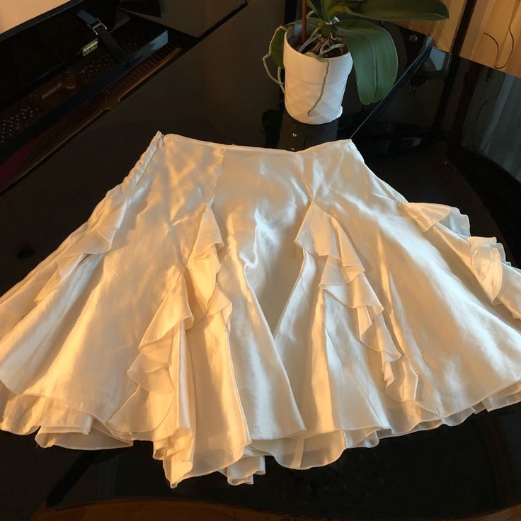 This New Without Tags Midi Skirt Is A Gorgeous, Shiny 100% Silk . Beautiful, Designer, Layered Skirt With A Side Zipper. Skirt Measures 20” Long, Waist Measures About 26”. Gorgeous Off White Color. Elegant Mini Pleated Skirt For Summer, Elegant Fitted Mini Skirt For Summer, Elegant Formal Mini Pleated Skirt, White Pleated Skirt For Summer Party, Elegant Pleated Mini Skirt For Spring, Elegant Mini Pleated Skirt For Spring, Elegant Mini Skirt For Spring, Elegant Mini Pleated Skirt With Lining, Elegant Mini Length Pleated Skirt With Lining