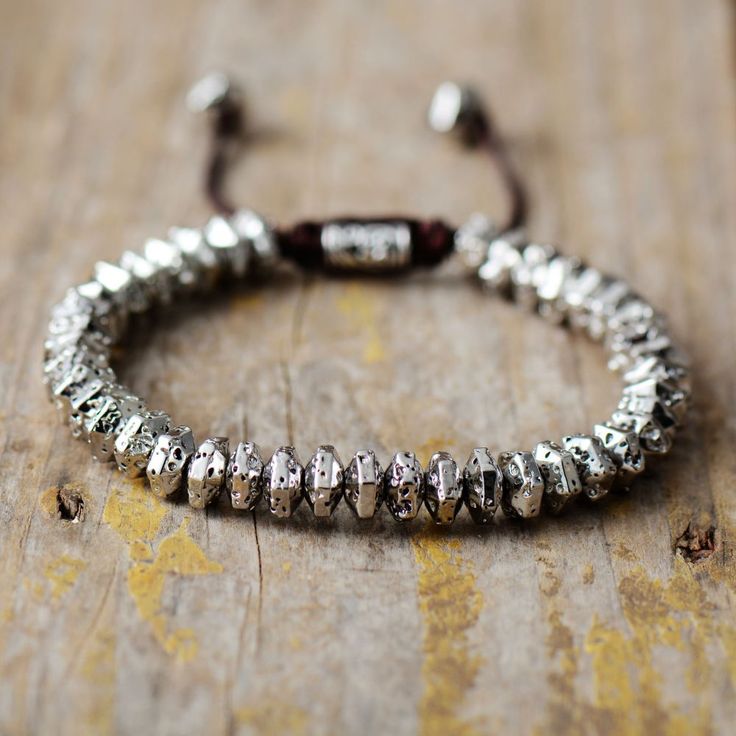 Experience the captivating energy of this handmade metal energy bracelet! Featuring seven mesmerizing beads crafted from lustrous metallic, it's perfect for adding an eye-catching, natural touch to your look. Experience the power of the metal to instantly infuse your aura with positivity and energy. Material: Hematite, Alloy. Size: women- 6.7"+ 3.9". /Men-7.3"+3.9" Technology: Handmade Bohemian Jewelry: Wear this bohemian jewel bracelet to add color to your daily life. The cool bohemian bracelet