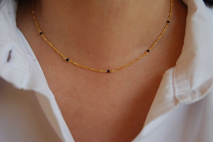 Sterling silver 925 onyx necklace with yellow gold plated and minimalist design, perfect for any occasion and to combine with other necklaces, chain measure: 40 cms (15-3/4 inin) width: 2 mm (0-25/32 inin) Elegant Handmade 14k Gold Necklaces, Elegant Handmade 14k Gold Necklace, Elegant Black Jewelry With Satellite Chain, Elegant Sterling Silver Necklace With Satellite Chain, Elegant Black Necklace With Satellite Chain, Minimalist Black Necklace With Satellite Chain, Elegant Black Gold-plated Chain Necklace, Elegant Black Gold Plated Chain Necklace, Handmade Minimalist Gold-plated Necklaces