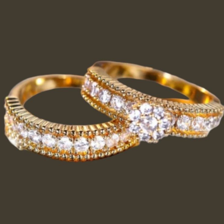 two gold wedding rings with diamonds