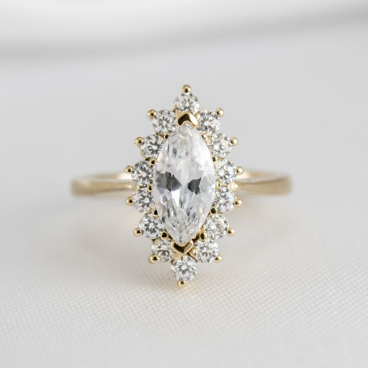 Shown in 1.25 Carat * The Hadley Marquise Diamond Engagement Ring | Lisa Robin#color_14k-yellow-gold Marquise Diamond Ring Vintage, Engagement Ring Quiz, Round Diamond Halo Engagement Ring, Round Diamond Engagement Rings Halo, Round Diamond Halo, Marquise Diamond Engagement Ring, Marquise Diamond Ring, Colored Engagement Rings, Buying An Engagement Ring