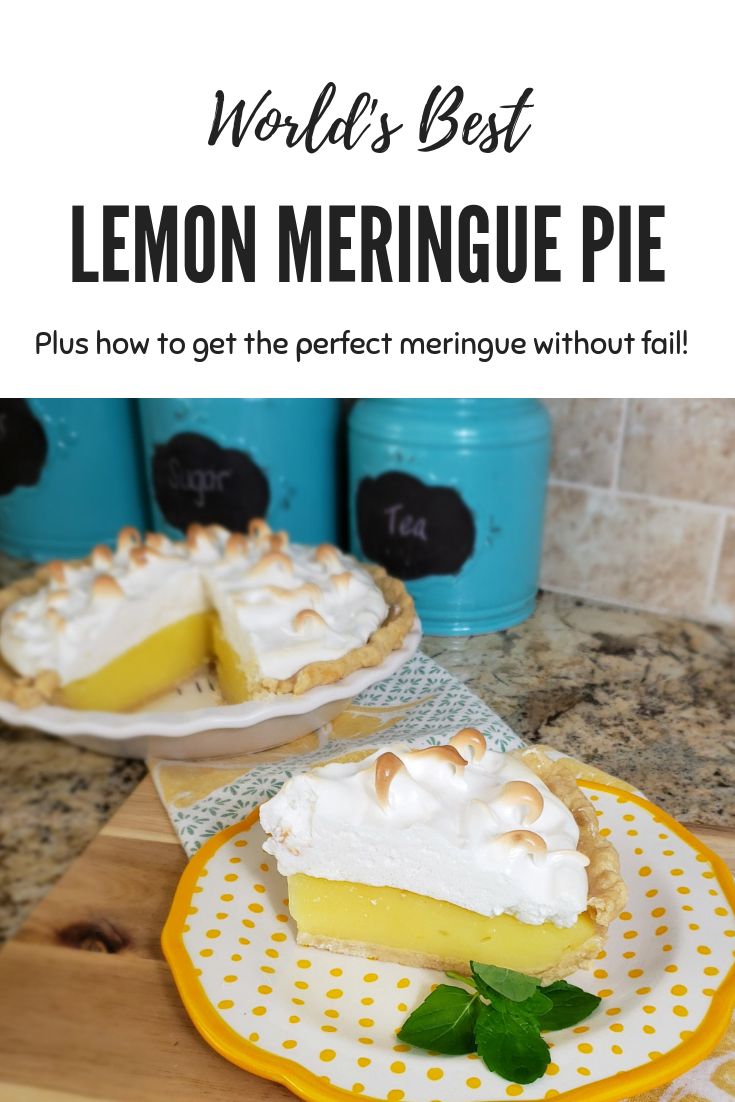 two lemon meringue pies sitting on top of a wooden cutting board next to each other