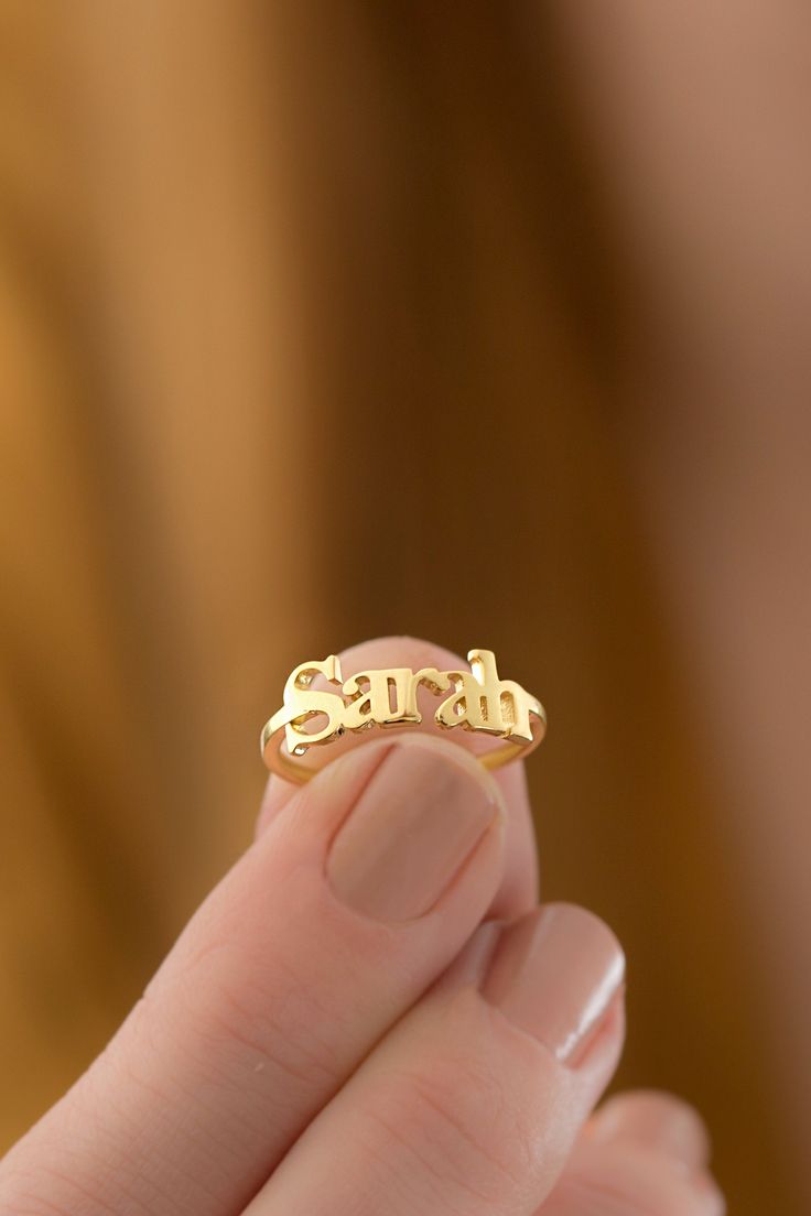 10k 14k 18k Solid Gold Custom Name Ring, Personalized Name Jewelry Gift, Dainty Gold Stackable Ring, Stacking Ring Great Christmas Gift for Her Our gold rings are perfect choice for a Christmas, Mother's Day, valentine's day, birthday, wedding, anniversary, graduation, engagement, bridesmaid, and best friends gift. It's a good way to show appreciation to your mom, girlfriend, wife, grandmother, grandchildren, daughter, sister, best friend, boss or a co-worker. Also, a special treat just for your Personalized Engraved 14k Gold Ring, 14k Gold Jewelry With Hallmark For Personalized Gift, Gold Sterling Silver Initial Ring For Wedding, 14k Gold Elegant Engraved Ring, Gold Sterling Silver Ring With Hallmarks, Elegant 14k Gold Engraved Ring With Hallmark, Yellow Gold Nameplate Jewelry For Anniversary, Personalized Yellow Gold Jewelry With Hallmark, Fine Jewelry Engraved 14k Gold Ring