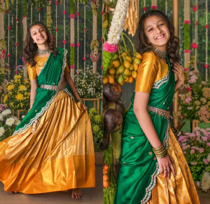 a girl in a green and gold sari posing for the camera with her hands on her hips