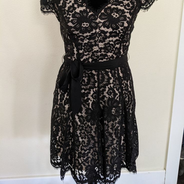 This Black Lace Dress Is Ready To Go To A Party! Never Worn, It Still Has Tags And Is Just Waiting For The Right Closet! Lace Fit And Flare Formal Dress, Formal Lace Fit And Flare Dress, Evening Lace Midi Dress Fit And Flare, Fitted V-neck Lace Dress For Party, Chic V-neck Lace Evening Dress, Chic Black A-line Lace Dress, Chic V-neck Lace Party Dress, Evening Lace Dress Fit And Flare A-line, Evening Fit And Flare A-line Lace Dress