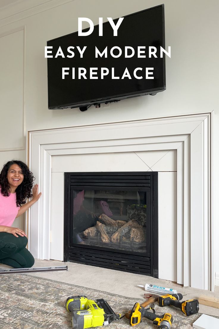 a woman sitting on the floor in front of a fire place with tools around her