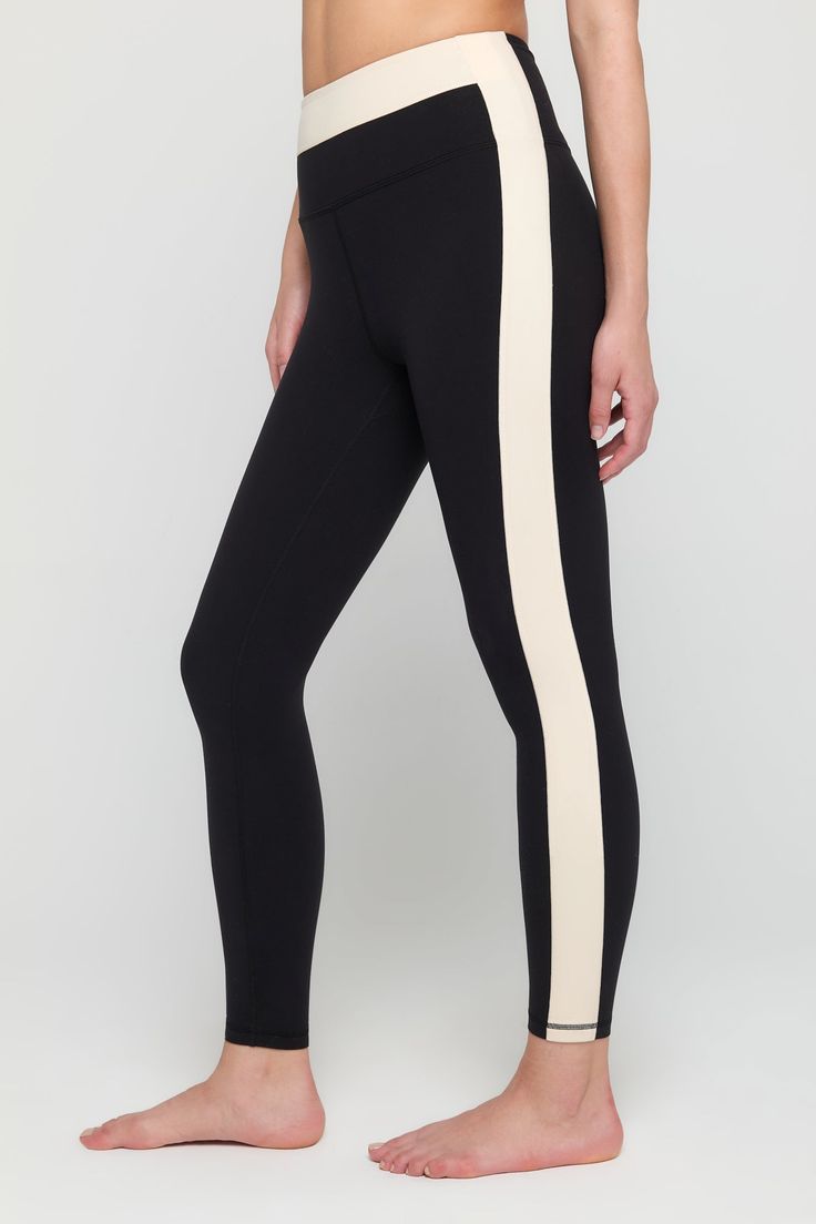 Meet your wear-everywhere leggings. Pair them with a cozy sweater, oversized tee, or with the cutest matching Aurora workout bra. Anyway you spin it, these sculpting, moisture-wicking wonders are the ready for the occasion. Squat-proof and lifting ready Ultra-flattering, sculpted compression Comfort-driven flatlock seams Breathable and moisture-wicking Contrasting colorblock design | Leighton Colorblock Legging in Black Fitted Activewear With Contrast Stripes For Workout, White Color Block Activewear Athleisure, White Color Block Athleisure Activewear, White Color Block Activewear Athleisure Style, Stretch Activewear With Contrast Stripes For Sports, Fitted Gym Activewear With Contrast Panels, Black Activewear With Contrast Stripes For Workout, Black Stretch Activewear With Contrast Stripes, Sporty Activewear With Contrast Stripes For Sports