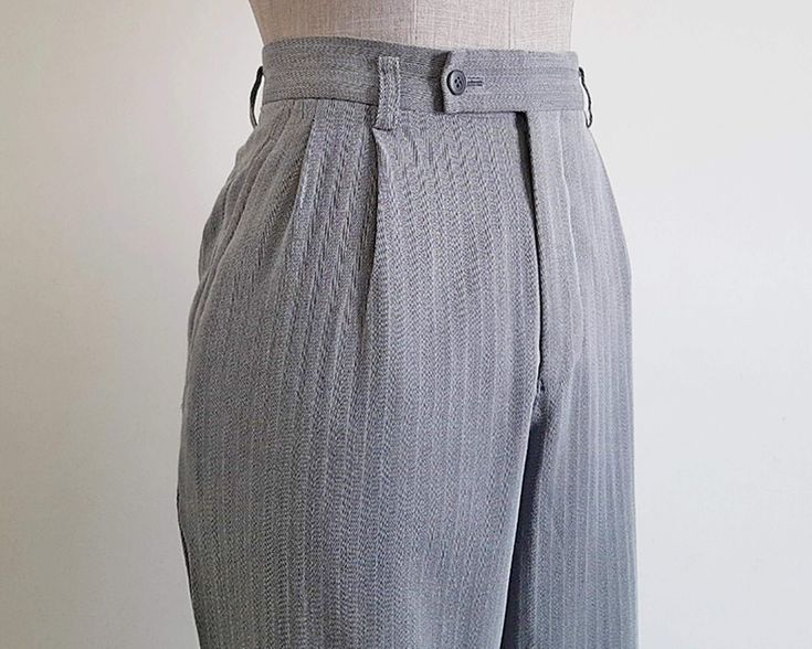 Vintage Gray Straight Leg Pants  - Fabric : 100% wool  - Nylon zipper on the front - Pockets - Made in Japan Good vintage condition but the pants has a flaw. Please see the last photo. Measurements : Waist : 30" Hips : 40" Front rise : 12" Back rise : 17.5" Inseam : 28" Total length : 38.5" Width of hem : 17" Our products are vintage clothing that will be cleaned so you can be confident in the quality. We carefully inspect each garment to make sure that you get the most accurate and informed description possible. We do our best to state any imperfections in the listing. If a flaw accidentally escapes our inspection, please let me know as soon as possible and we will be happy to help remedy the situation. Please read the product description carefully before purchasing to ensure it meets you Fitted Wool High Waist Bottoms, Fitted High Waist Wool Bottoms, Fitted Wool High-waisted Bottoms, Fitted High Waist Wool Pants, High Waist Wool Bottoms For Formal Occasions, Tailored High Waist Wool Bottoms, Tailored High Waist Wool Pants, High Waist Wool Bottoms With Pockets, Fitted Vintage Wool Pants