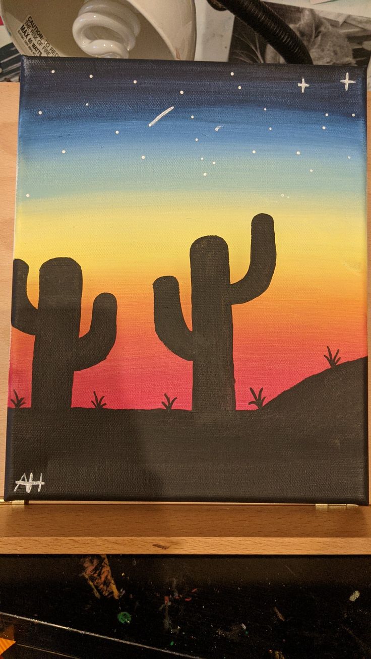 an acrylic painting of cactus at sunset