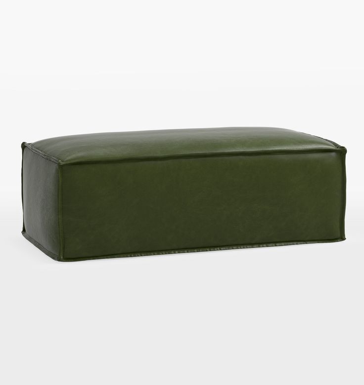 an olive green leather ottoman with black piping on the top and bottom, sitting in front of a white background