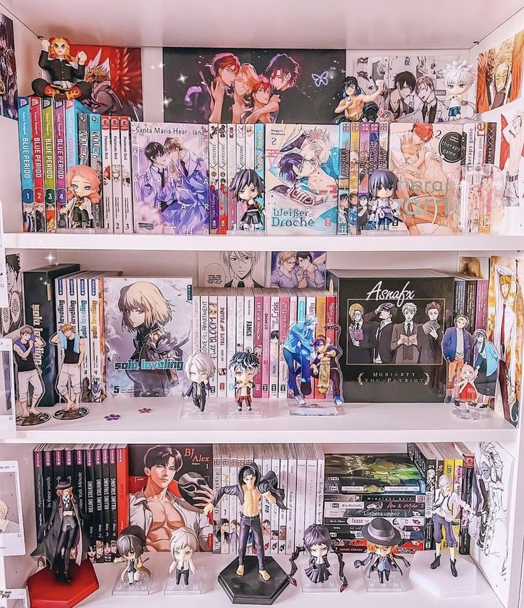 a book shelf filled with anime books and figurines on top of each shelf