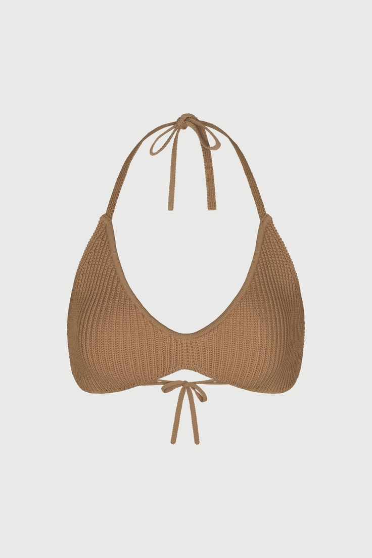 Our knit halter bra-like crop top is a summer essential. It's simple to pack, easy to wear, and lends textural contrast to seasonal pairings with pants, skirts, and shorts. A softened triangle style front ties at the neck and back for an added effortless vibe. Knit Collection Import Self: 63% Viscose, 37% Nylon Model wears size Small True to size Chic T-back Halter Top For Beach, Spring Beachwear Seamless Crop Top, Spring Beach Crop Top With T-back, Chic Triangle Halter Top For Beach Season, Spring Beach T-back Crop Top, Summer Triangle Crop Top With Tie Back, Summer Triangle Top Crop Top With Tie Back, Casual Seamless Halter Top For The Beach, Summer T-back Halter Top